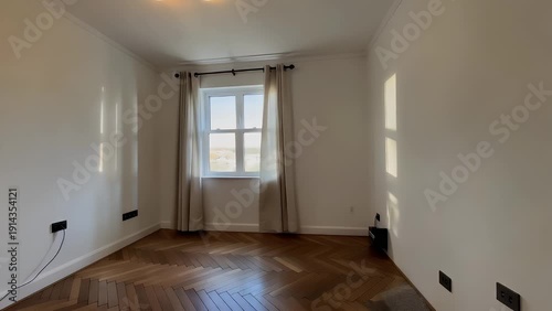 Unfurnished Interior Space Featuring Wooden Flooring, a Window, and Bare Walls Ready for Decoration and Furnishing