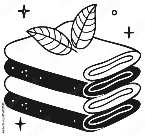 Hand drawn stack of folded fabric cloths with leaves and decorative sparkles in black and white