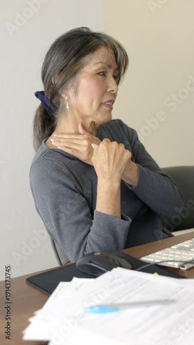 Frustrated business woman working at home stressed rubbing neck discomfort sitting at computer monitor vertical video