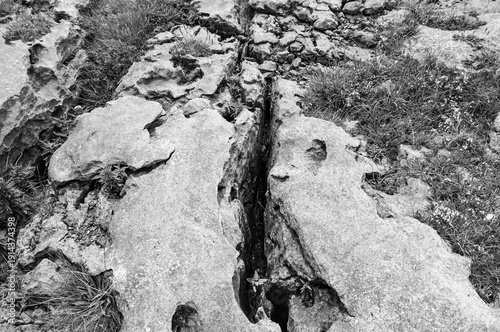 A rocky area with a large crack in the middle