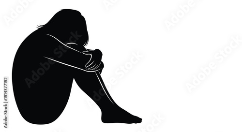 A solitary figure huddled in despair a striking black silhouette