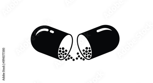 Opened capsule with spilling contents a stark black silhouette