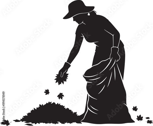 Silhouette of a woman in a hat gathering fallen autumn leaves into a large bag, representing seasonal yard work and fall clean-up.
