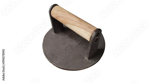 Fotografie Burger press or Beef smash tool of cast iron with a wooden handle in a transpare