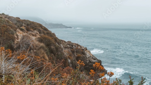 Sunset Over the Coastline With Rock Formations and Beach Scene Near the Water...