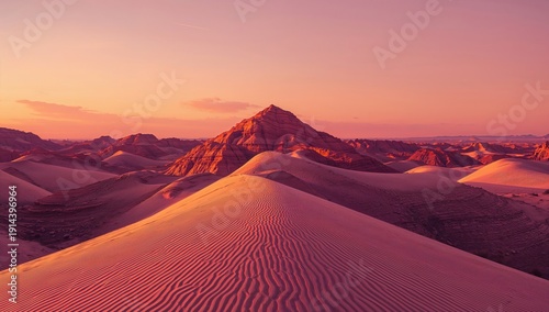 Sand Dunes Stretch Under a Clear Sky at Sunset in a Desert Landscape