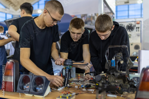 Students learning automotive electronics and engineering skills