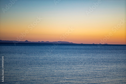 Minimalist Ocean Horizon at Sunset with Distant Mountain Silhouette - Serene Icelandic Seascape at Dusk