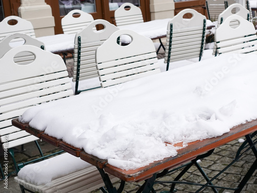Snow covered outdoor restaurant terrace in winter