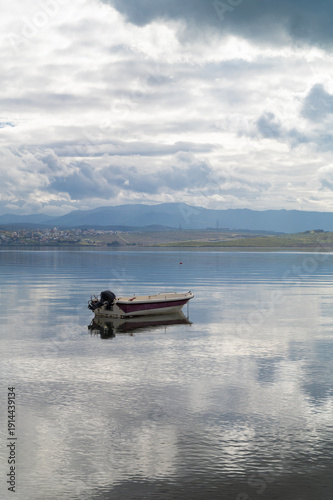Wallpaper Mural With calm, reflective sea and boats and cloudy sky Torontodigital.ca