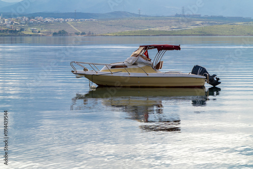 Wallpaper Mural With calm, reflective sea and boats and cloudy sky Torontodigital.ca