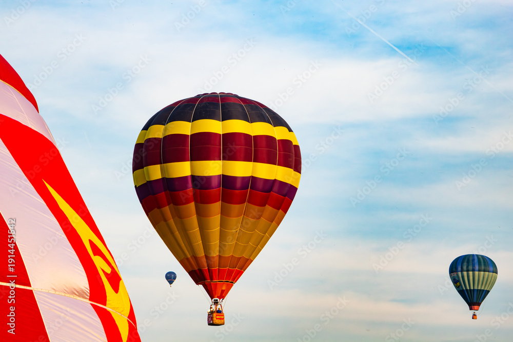 Fototapeta premium Colorful hot air balloons flying in blue sky