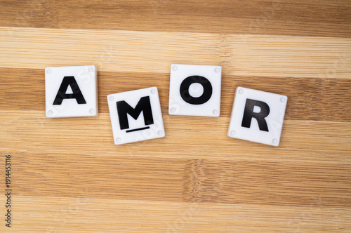 love word in language Spanish, collage of isolated text in vintage letterpress wood type printing blocks,
