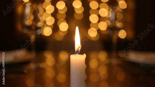 Candlelight dinner ambiance with blurred bokeh lights in the background.