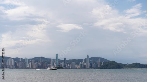 Timelapse of Balneário Camboriú skyline with boats in the foreground