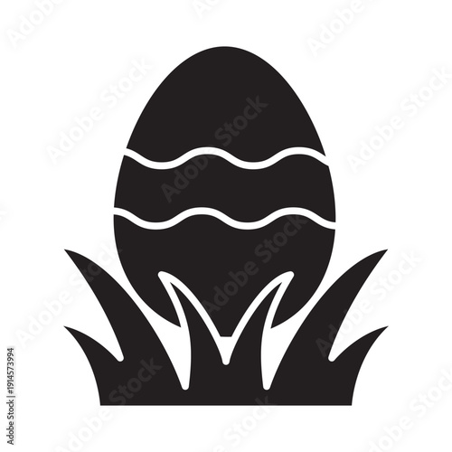 Easter egg in grass solid icon. Black silhouette vector of decorated egg and spring meadow. Minimalist holiday symbol, seasonal celebration graphic. Professional flat design, high contrast.