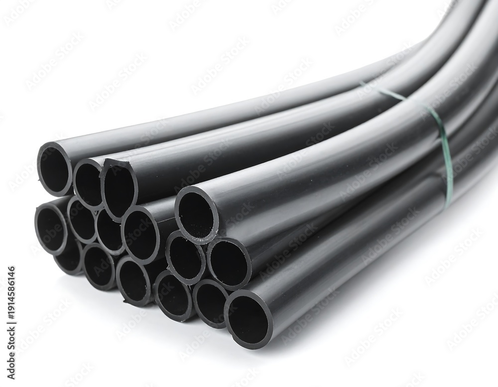 Fototapeta premium Stack of black, smooth, round pipes bundled with green tape on a white background