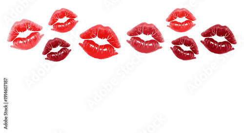 A row of red lipstick kiss marks on a white background, varying shades and sizes.