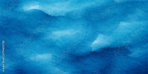 A dark blue abstract grunge background captures a storm cloudscape where sunlight breaks through the white clouds over a deep sea texture