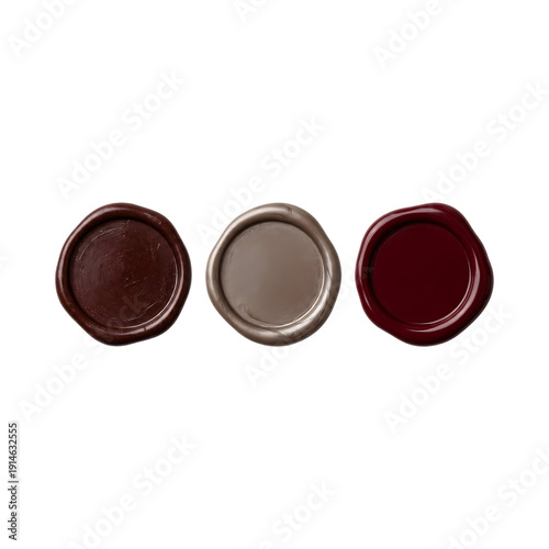 Three wax seal stamps in different colors brown beige and dark red, traditional ancient method of authenticating documents or sealing letters