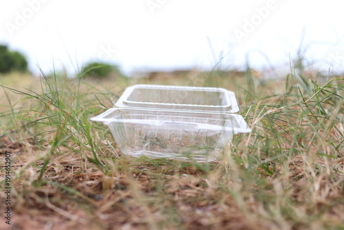 Photography Food containers, plastic discarded on the grass, haphazard littering