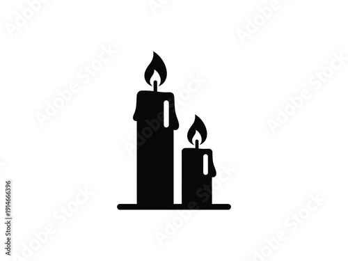 Two black candles with flames, one taller than the other, representing ambiance, remembrance, or a spiritual mood.