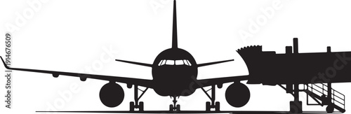 Black airplane docked at airport gate with jet bridge attached