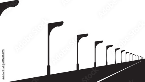 Black street lamps receding into distance on a road