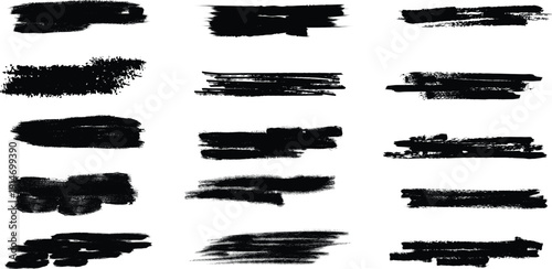 Collection of black brush stroke textures and smudges on white background