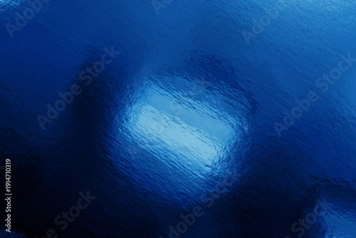 Abstract blue reflection on a glossy surface with cyan light and textured rip...