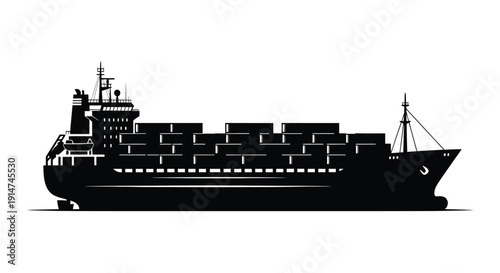 Black silhouette of a large container ship at sea
