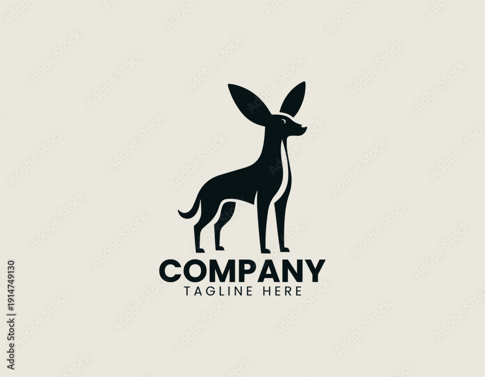 Fototapeta premium Black vector logo dog standing in alert pose with large floppy ears and slim body proportions