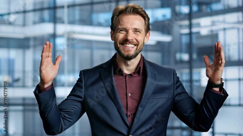 Confident Businessman Celebrating Success With Open Arms In A Modern Office Building