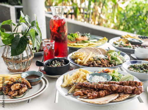 Wallpaper Mural many different mediterranean food dishes on restaurant table in greece Torontodigital.ca