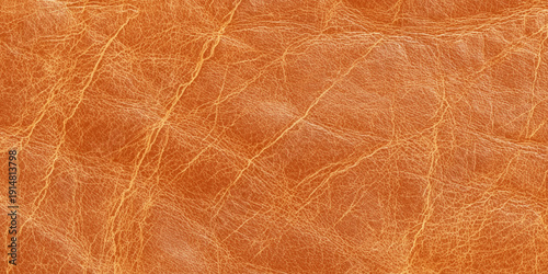 Abstract closeup of orange leather surface featuring natural grain warm earthy tones and detailed texture create a versatile background.