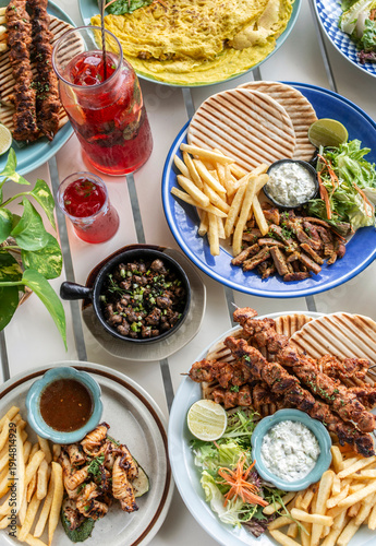 Wallpaper Mural many different mediterranean food dishes on restaurant table in greece Torontodigital.ca