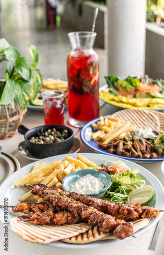 Wallpaper Mural many different mediterranean food dishes on restaurant table in greece Torontodigital.ca