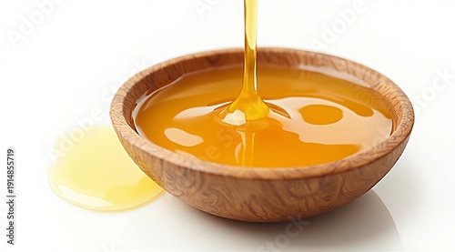 Golden honey drips into a wooden bowl against a soft bokeh background. Stylish food photography for packaging, recipes, or organic product advertisements