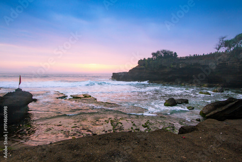 Indonesian temple in sea with tourist. Tanah lot complex. Bali. Indonesia