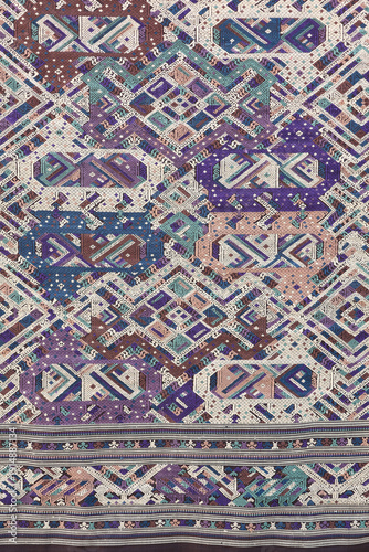 Traditional Lao textile pattern with intricate geometric woven ethnic design.