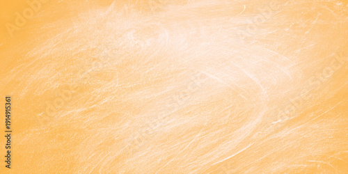 A close up of bread and an egg over an orange background resting on a natural brown wooden board with a textured grain timber surface