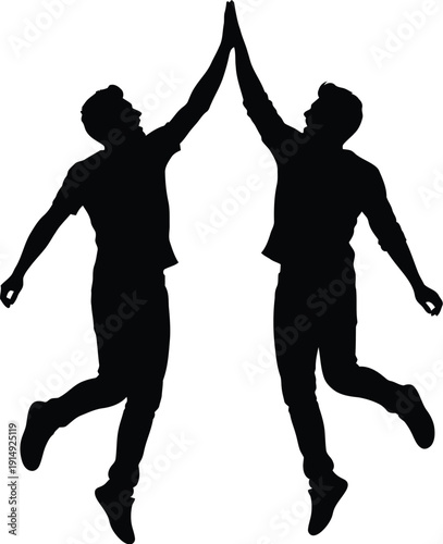 Silhouettes of two joyful men jumping high giving a triumphant high five.