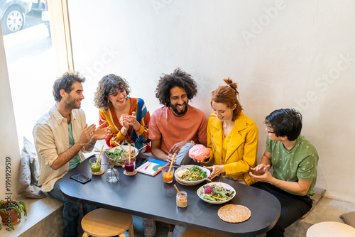 Group of friends having lunch in a restaurant