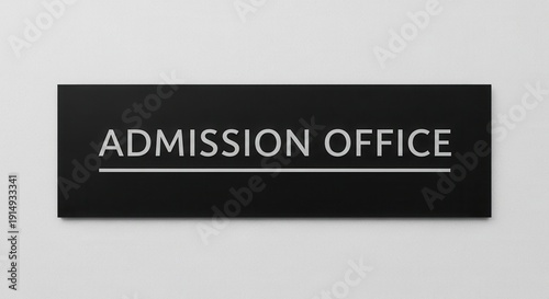 Minimalist Admission Office Signage On Black Panel Indicating Entrance Location