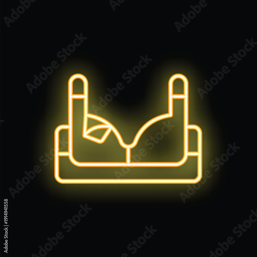 Yellow neon sign of a bra on a black background