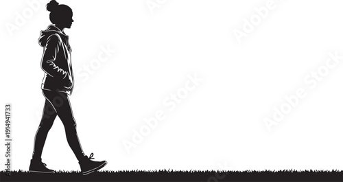 Silhouette of a woman walking in a hooded jacket on grass Keywords: silhouette, woman, walking