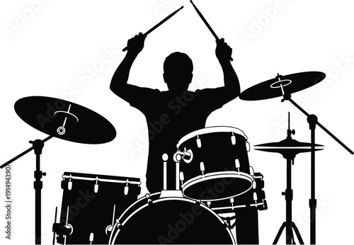 Drummer silhouette energetically playing a full acoustic drum set on stage.