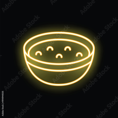 Yellow neon sign illustrating a bowl of soup, glowing on a black background