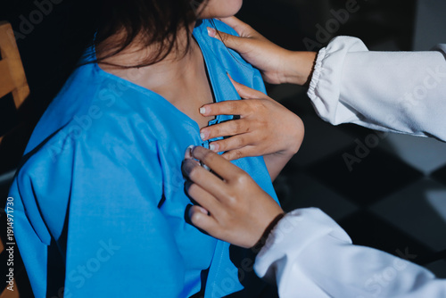 healthy concept; Doctor checking patient's heart with stethoscope at a hospital