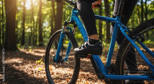 Black cycling shoe hook and loop pedal engagement blue mountain bike frame sunny forest trail outdoor sport leisure activity
